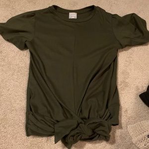 A short sleeve olive green shirt.